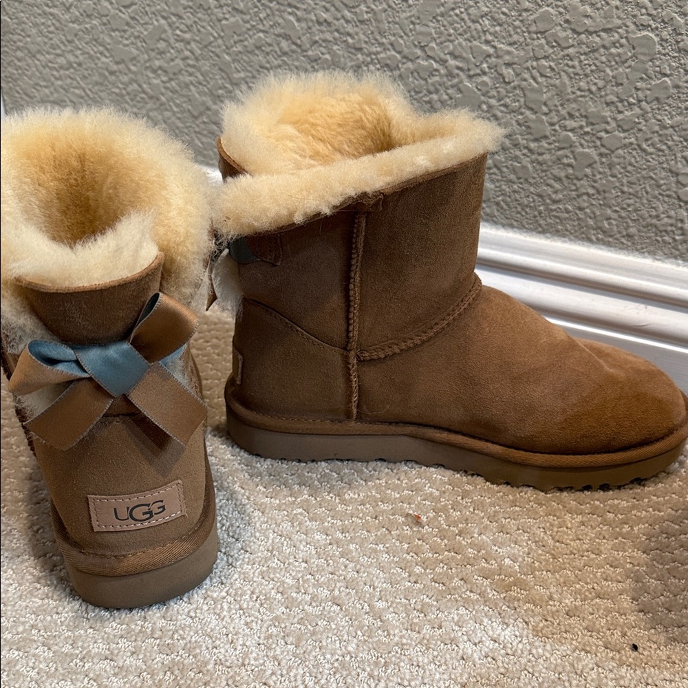 UGG Tan Sheepskin Boots with Blue Bows